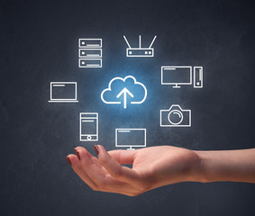 Hand holding technology related icons