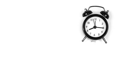 Black alarm clock isolated on white background, top view