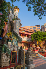 Fototapeta na wymiar Colorful God statues are located at the Repulse Bay is a quaint Taoist temple which is popular for its colorful mosaic statues