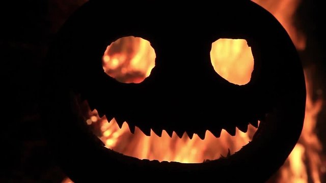 pumpkin head with a fire in the eyes and mouth