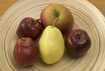 Bamboo bowl with fruit - apples and a pear