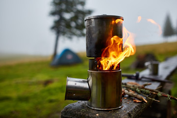 Cooking in a pot over the firewood stove