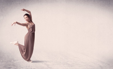 Modern ballet dancer performing art jump with empty background