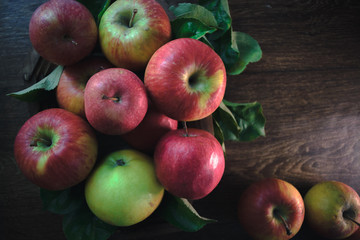 Fresh ripe apples on a wooden background. Autumn still life.