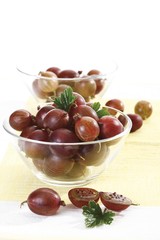 Red gooseberries in a glass bowl
