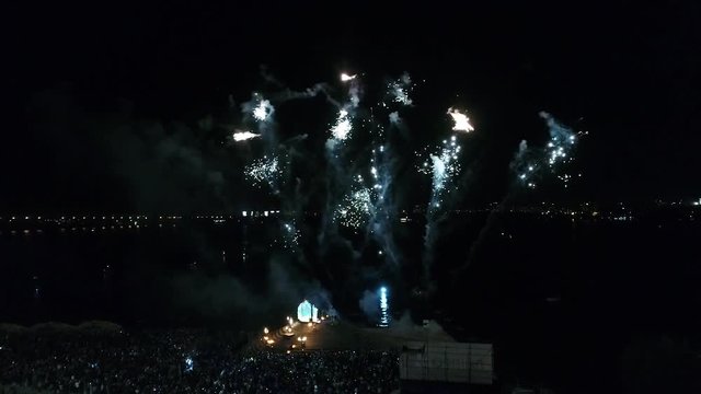 Aerial shooting of the fire show during a salute above the river