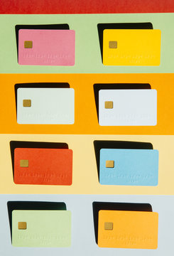 Eight blank credit cards on striped background
