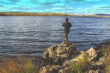 People taking pictures of autumn scenery