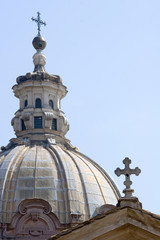 Fototapeta na wymiar Crosses on churchdomes in Rome Italy Europe
