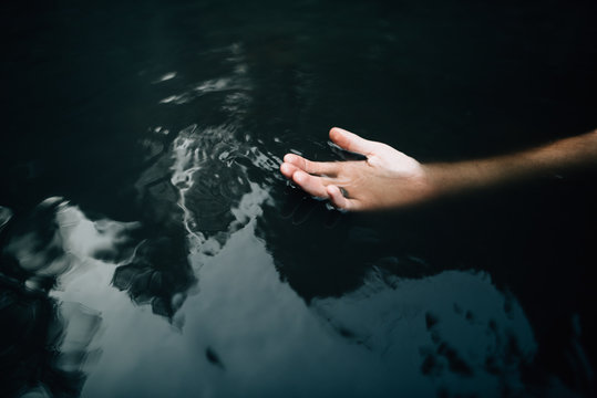 Hand In Body Of Water