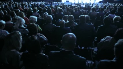 Speaker giving a talk on scientific conference. Audience at the conference hall. Business and Entrepreneurship concept.