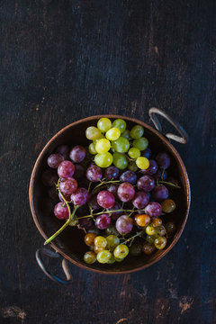 Grapes still life on wooden table