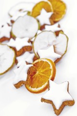 Cinnamon stars and dried orange and apple slices