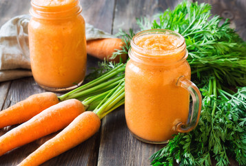 Fresh carrot smoothie in jars