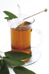 Sage tea garnished with rock candy and sage leaves