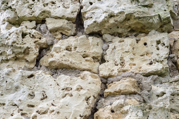 Fragment of an old wall from dolomite close up