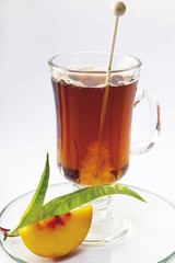 Glass of peach tea and rock candy