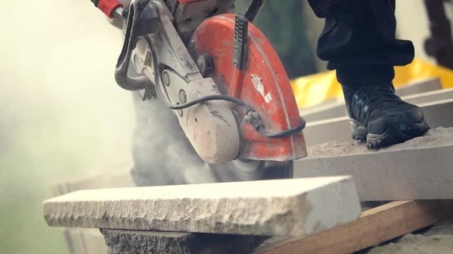 Construction Worker Cutting Stone Using Powerful Stone Cutter Power Tool