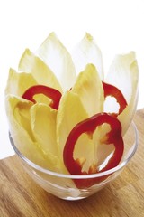 Chicory and red capsicum in a glass bowl