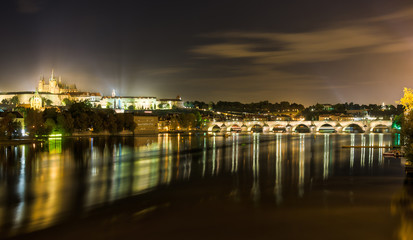 The illuminated Charles Bridge and the Castle of Prague by night