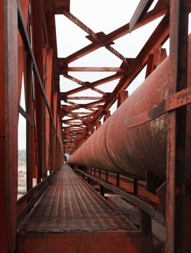 An industrial gas pipelines on pipe-bridge was laid over the river