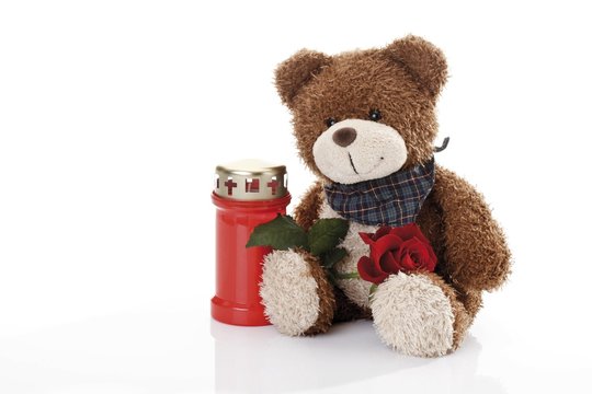 Teddy bear and a grave candle
