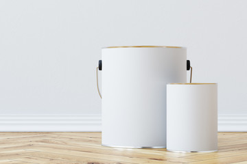 Gray paint buckets of different sizes