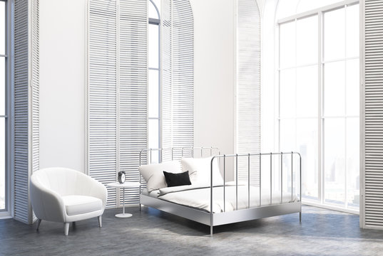 White luxury bedroom interior, gray floor, armchair