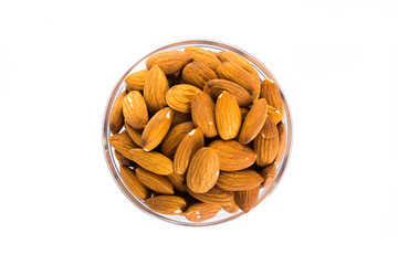 Group of almonds placed in a bowl on a white background