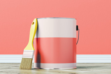 Red paint bucket and a brush