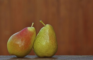 Two pears on a old wooden table
