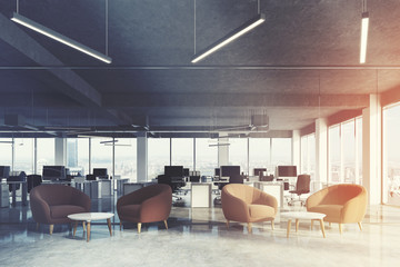 Waiting area in office, brown armchairs toned