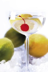 Cocktail with lemon and a cocktail cherry