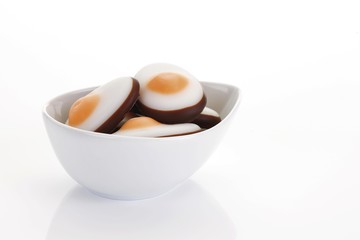Fondant easter fried eggs in a porcelain bowl