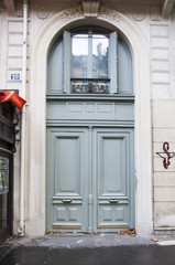 Fototapeta na wymiar The door of an old tenement house