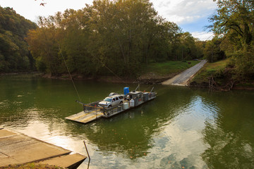 A ferry moves passengers across the Green River in Kentucky