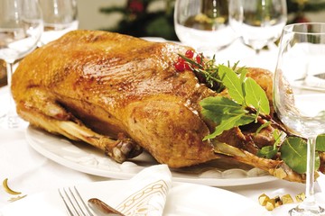 Roast goose on a festively decorated table