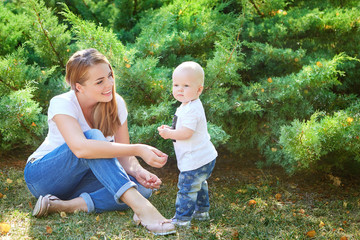 Happy beautiful mother and baby daughter or son