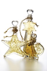 Fototapeta na wymiar Cosmetic bottles with golden glitter, Christmas decoration