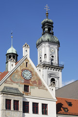 Fototapeta na wymiar Freising Upper Bavaria Germany Marienplatz gable of the city hall in front of the tower of the parish church St Georg