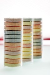 Three rolls of multicoloured grape sugars