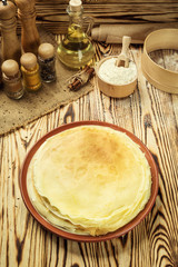 Stack of pancakes,One plain pancakes,Breakfast,snacks.Pancakes Day.Stack of kefir (buttermilk) pancakes,High stack of pancakes . Breakfast for the whole family.With copy space.Shallow DOF