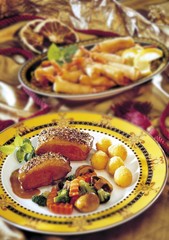 Duck breast with side dishes, battered shrimp, vegetables and croquettes