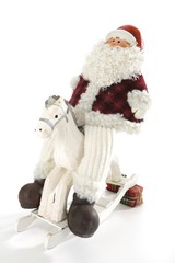 Santa Claus figuring on a rocking horse, Christmas decoration