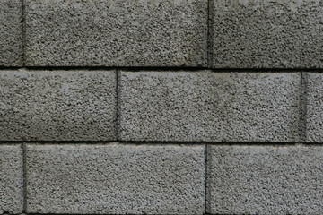 mauer aus stein mit groben steinen in grau als hintergrund