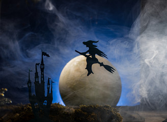 Fototapeta premium Halloween witch flying on broomstick, Halloween background.