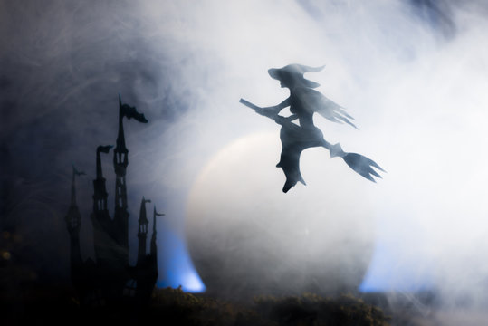 Halloween witch flying on broomstick,   Halloween background.