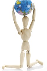 Kneeling wooden jointed figure holding a globe