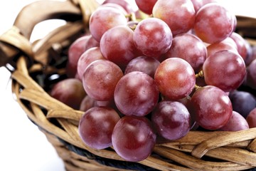 Red grapes in a little basket