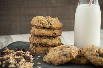 Fresh cookies with milk - chocolate chips and cranberries - favorite treat